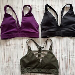 Three XS Victoria's Secret Sports Bras in black, burgundy and green